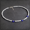 Naszyjnik evil eye bialy howlit granatowa